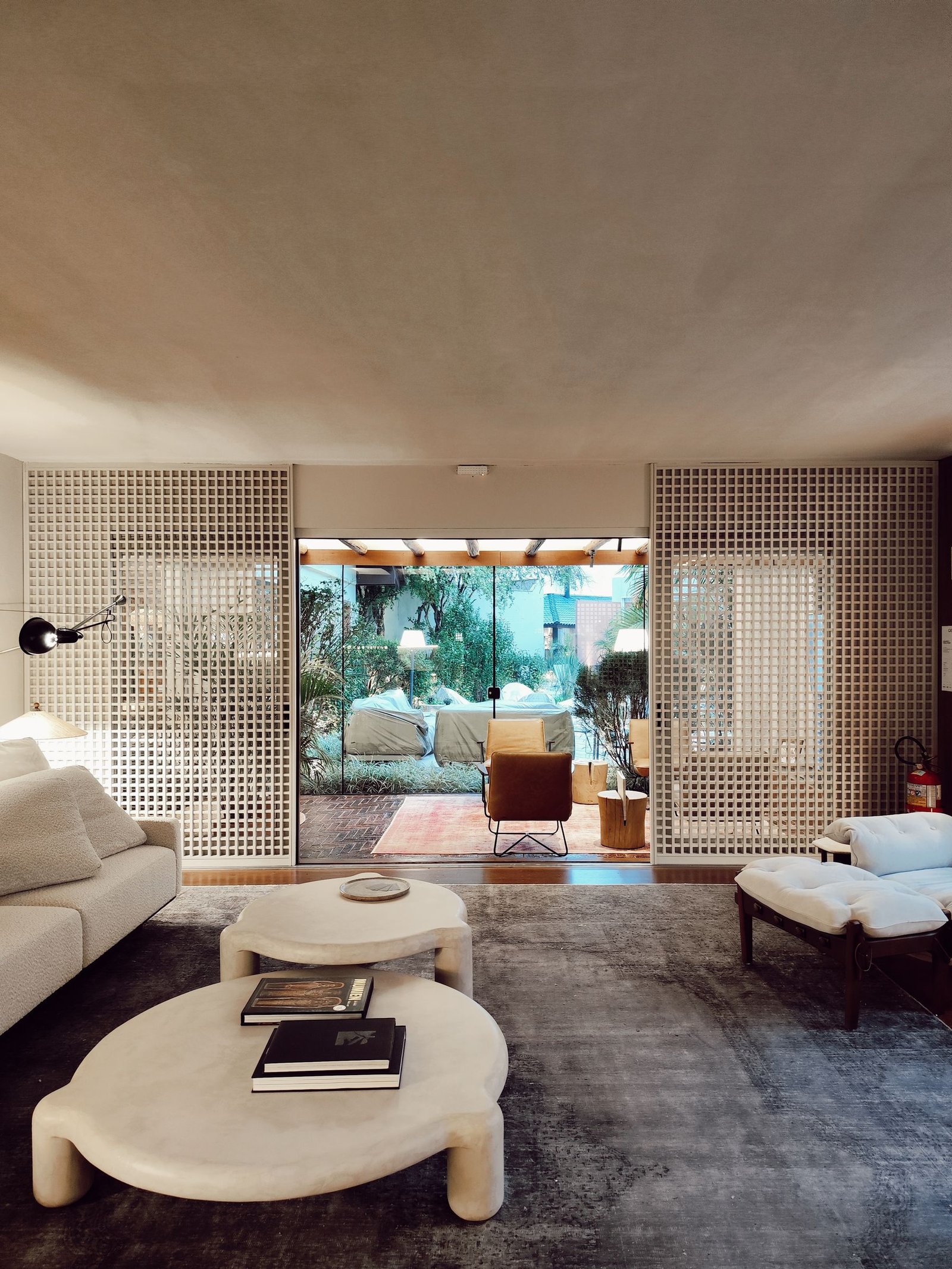 Furnished living room with wide garden-facing glass doors