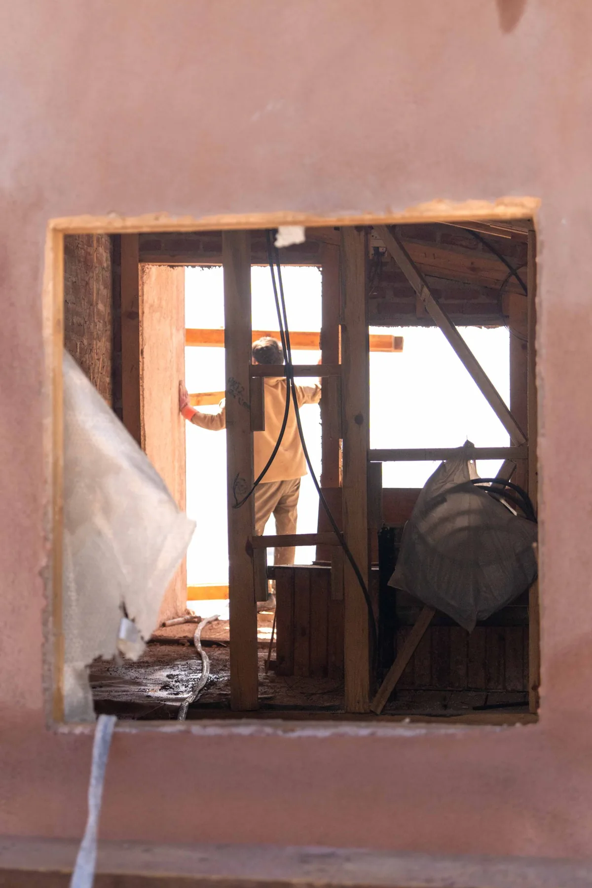 Worker carrying out an interior renovation during construction
