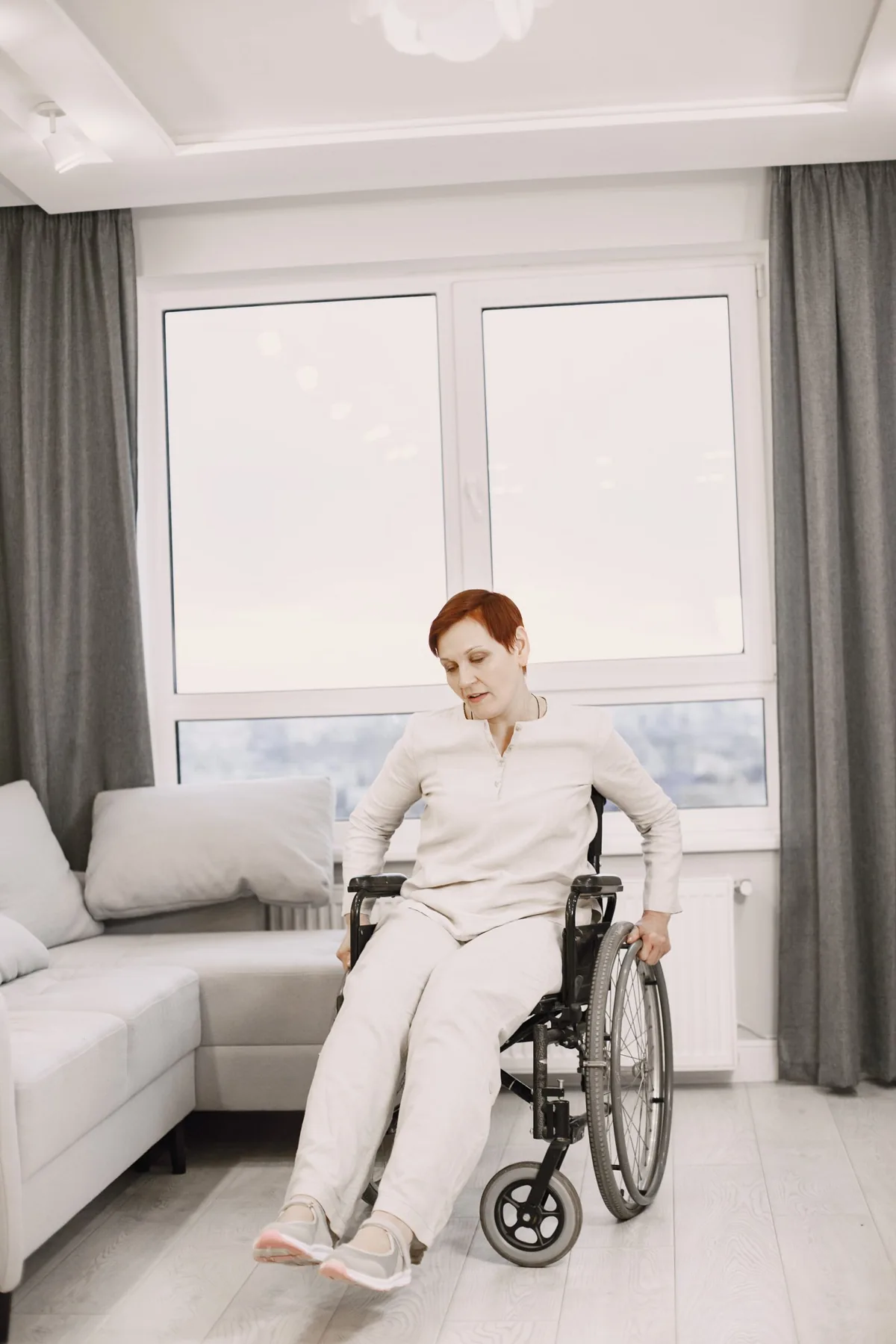 Older woman seated in a wheelchair at home