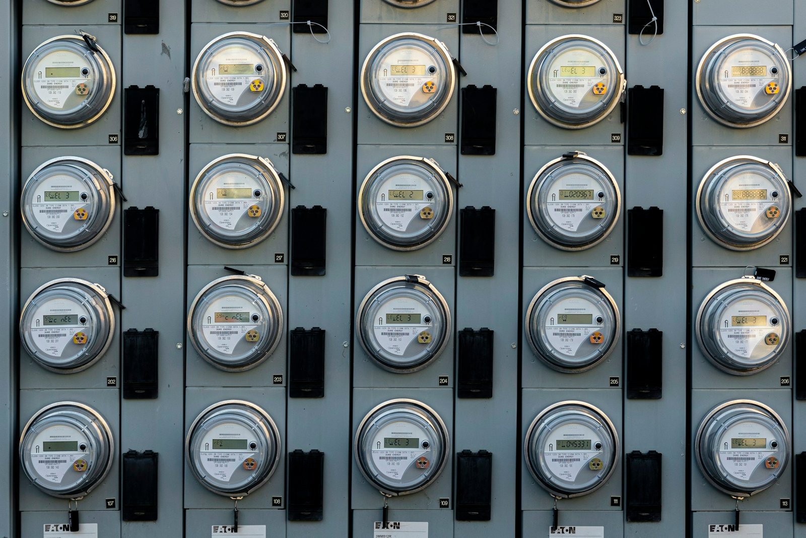 Bank of electric meters mounted in an exterior cabinet