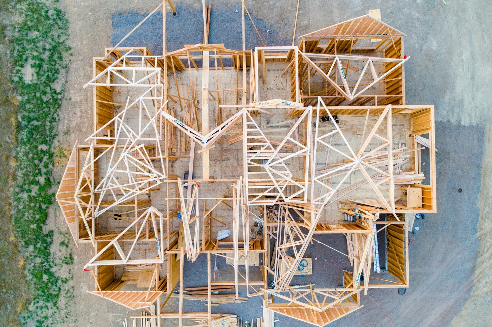 Overhead view of timber wall and roof framing under construction